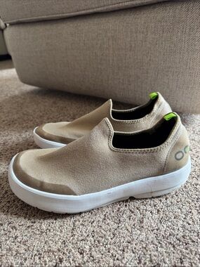 OOFOS Slip-On Sneakers in Tan with Neon Green Pull Tabs